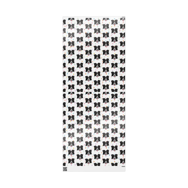 Black and white dog patterned wrapping paper sheet uncureled on a white background